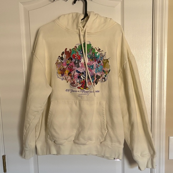 Disney Tops - Disney 100 Years of Music and Wonder Cream Hoodie with Character Graphics